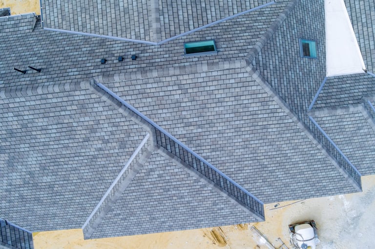 Overhead view of newly built house with gray slate roof