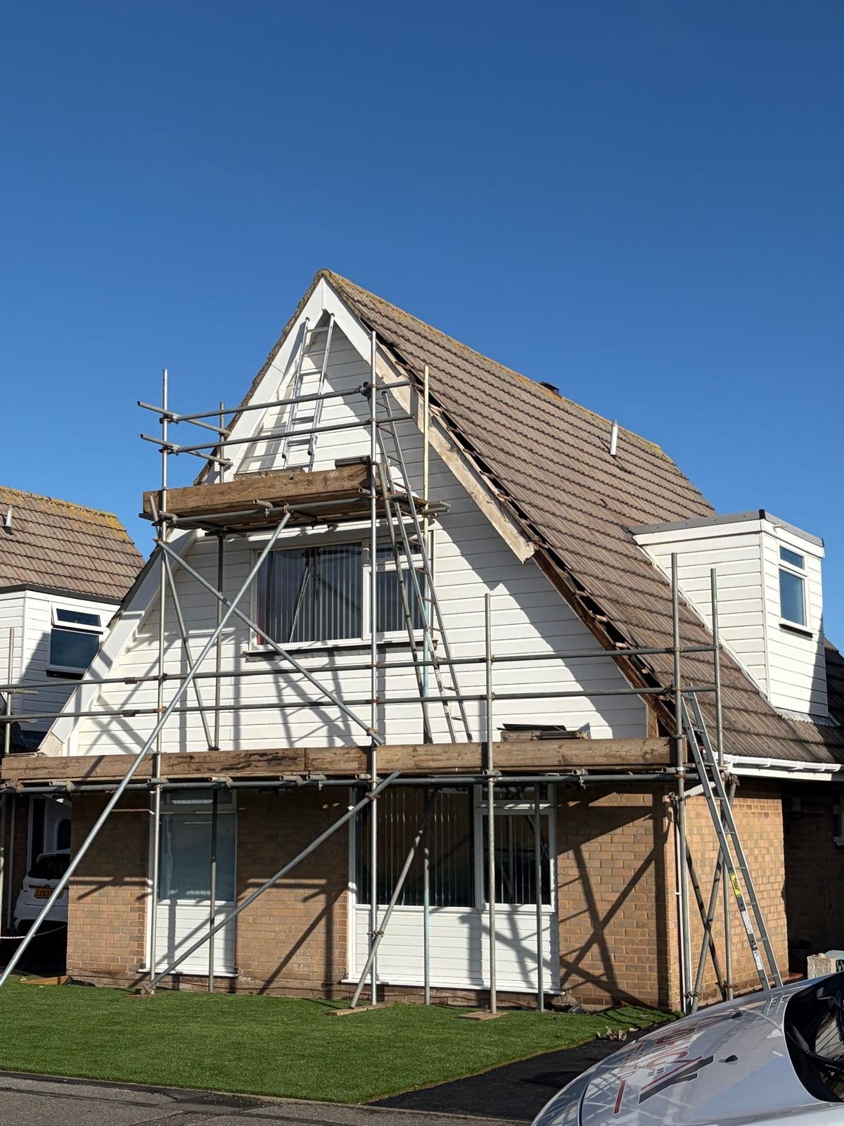 House with scaffolding during roof renovation